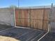 Sturdy wooden gate framed with metal, providing privacy and security to the property at 2837 W Almeria Rd, Phoenix, AZ 85009