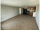 Open space with tiled floors flowing into a kitchen area with appliances at 2837 W Almeria Rd, Phoenix, AZ 85009