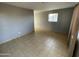 Bright living room with tiled floors and fresh paint at 2837 W Almeria Rd, Phoenix, AZ 85009