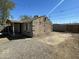 Exterior of a single-story home features low-maintenance landscaping and a private gravel drive at 2837 W Almeria Rd, Phoenix, AZ 85009