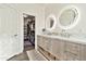 Spacious bathroom featuring a walk-in closet, double sinks, and modern vanity at 2861 E Camellia Dr, Gilbert, AZ 85296