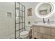 Modern bathroom featuring a glass shower, vanity with quartz counters, and white subway tile at 2861 E Camellia Dr, Gilbert, AZ 85296