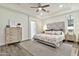 Inviting bedroom with a neutral color palette, ceiling fan, and a walk-in closet at 2861 E Camellia Dr, Gilbert, AZ 85296