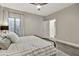 Comfortable bedroom featuring a wrought iron bed, soft bedding, and a bright window view at 2861 E Camellia Dr, Gilbert, AZ 85296