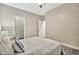 This bedroom features neutral walls, a ceiling fan, and plush bedding, creating a serene and inviting atmosphere at 2861 E Camellia Dr, Gilbert, AZ 85296