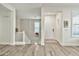 Bright entryway featuring hardwood floors, staircase, and a welcoming white front door at 2861 E Camellia Dr, Gilbert, AZ 85296