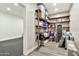 View of pantry with wooden shelves, storage and access to the workout room at 2861 E Camellia Dr, Gilbert, AZ 85296