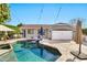 Sparkling pool with waterfall feature highlights this home's desirable backyard retreat at 2861 E Camellia Dr, Gilbert, AZ 85296