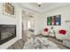 Sitting room featuring a fireplace, modern decor, hardwood floors, and views of the bedroom at 2861 E Camellia Dr, Gilbert, AZ 85296