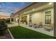 Expansive covered patio with outdoor seating and lush lawn, perfect for entertaining at 28714 N Verde River Way, Rio Verde, AZ 85263