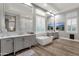 Luxurious main bathroom with dual vanities, soaking tub, ample natural light, and elegant finishes at 28714 N Verde River Way, Rio Verde, AZ 85263