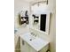 Clean bathroom features a white vanity with a modern faucet and a mirrored medicine cabinet at 3131 W Cochise Dr # 157, Phoenix, AZ 85051