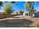 The low-maintenance desert rock landscaping is a great feature of the backyard at 3223 W Purdue Ave, Phoenix, AZ 85051