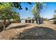 Expansive backyard featuring desert rock landscaping, providing low maintenance and ample space at 3223 W Purdue Ave, Phoenix, AZ 85051