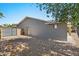 This shot showcases the backyard with its desert landscaping and side yard gate at 3223 W Purdue Ave, Phoenix, AZ 85051