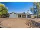 Back of house featuring covered patio and low maintenance desert landscaping at 3223 W Purdue Ave, Phoenix, AZ 85051