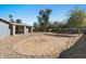 Spacious backyard with desert rock and a patio area, perfect for outdoor entertaining at 3223 W Purdue Ave, Phoenix, AZ 85051