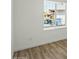 Bedroom featuring wooden floors, white walls, and a window at 3223 W Purdue Ave, Phoenix, AZ 85051