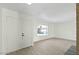 Bright entryway with wood-look flooring and a large window, creating a welcoming space at 3223 W Purdue Ave, Phoenix, AZ 85051