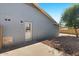 View of the house showcasing the neutral brick and desert rock yard at 3223 W Purdue Ave, Phoenix, AZ 85051