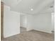 Inviting living space with bright white walls and tile flooring leading to other rooms at 3223 W Purdue Ave, Phoenix, AZ 85051