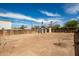 Large backyard with a wooden fence and small sheds, perfect for outdoor activities at 4205 N 3Rd Ave, Phoenix, AZ 85013