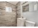 Bathroom featuring stylish tile accents, modern fixtures, and a walk-in shower at 4205 N 3Rd Ave, Phoenix, AZ 85013