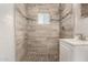 Bathroom featuring stylish tile accents, modern fixtures, and walk-in shower at 4205 N 3Rd Ave, Phoenix, AZ 85013