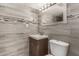 Updated bathroom featuring stylish tiled walls, modern fixtures, and decorative accents at 4205 N 3Rd Ave, Phoenix, AZ 85013