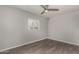 Comfortable bedroom with modern ceiling fan, window with blinds and hardwood floors at 4205 N 3Rd Ave, Phoenix, AZ 85013