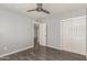 Bedroom featuring modern ceiling fan, hardwood floors, and a double door closet at 4205 N 3Rd Ave, Phoenix, AZ 85013