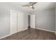 Bedroom with hardwood floors, window with blinds and a double door closet at 4205 N 3Rd Ave, Phoenix, AZ 85013