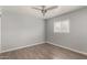 Cozy bedroom features natural light, hardwood floors, and a window with blinds at 4205 N 3Rd Ave, Phoenix, AZ 85013