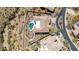 An overhead shot of a well maintained desert home including tile roof and backyard pool at 42429 N Cross Timbers Ct, Anthem, AZ 85086