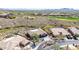 Aerial view of desert home, lush native landscaping, and private drive at 42429 N Cross Timbers Ct, Anthem, AZ 85086