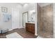 Stylish bathroom featuring a walk-in shower and wood grain vanity with ample counter space at 42429 N Cross Timbers Ct, Anthem, AZ 85086