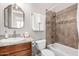 Bathroom features a tiled shower, single vanity with decorative mirror at 42429 N Cross Timbers Ct, Anthem, AZ 85086