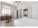 Bedroom features plantation shutters, ceiling fan, and a rocking chair at 42429 N Cross Timbers Ct, Anthem, AZ 85086