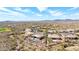 Aerial shot of a desert home with a pool surrounded by a beautiful community at 42429 N Cross Timbers Ct, Anthem, AZ 85086