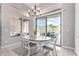 Dining area with sliding doors to the patio and desert views at 42429 N Cross Timbers Ct, Anthem, AZ 85086