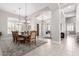 Elegant dining room with high ceilings, chandelier, and arched entryway at 42429 N Cross Timbers Ct, Anthem, AZ 85086