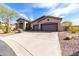 Desert home with three car garage and low-maintenance desert landscaping at 42429 N Cross Timbers Ct, Anthem, AZ 85086