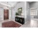 Inviting foyer with dark wood front door, console table and views of the bedroom at 42429 N Cross Timbers Ct, Anthem, AZ 85086