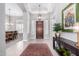 Expansive foyer features a pendant light, tray ceiling and view of the dining room at 42429 N Cross Timbers Ct, Anthem, AZ 85086