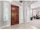 Foyer with a dark wood door and views into the front office at 42429 N Cross Timbers Ct, Anthem, AZ 85086