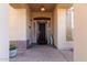 Inviting front porch with a decorative screen door and lantern style light at 42429 N Cross Timbers Ct, Anthem, AZ 85086