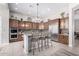 Stylish kitchen with stainless steel appliances, granite countertops, and mosaic backsplash at 42429 N Cross Timbers Ct, Anthem, AZ 85086