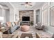 Spacious living room with wood accent wall, modern furnishings, and neutral color palette at 42429 N Cross Timbers Ct, Anthem, AZ 85086