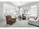 Bright home office featuring plantation shutters and a comfortable seating area at 42429 N Cross Timbers Ct, Anthem, AZ 85086