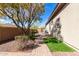 Side yard with desert landscaping and brick pathway at 42429 N Cross Timbers Ct, Anthem, AZ 85086